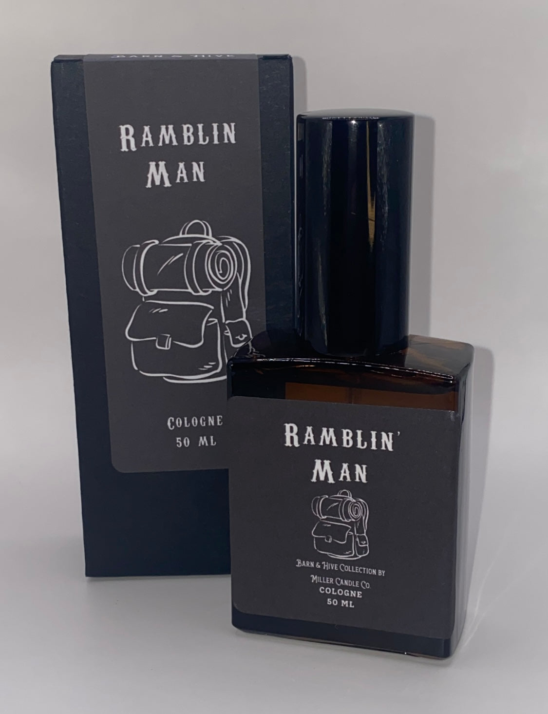 Black 'Ramblin Man' cologne bottle and packaging on a white background