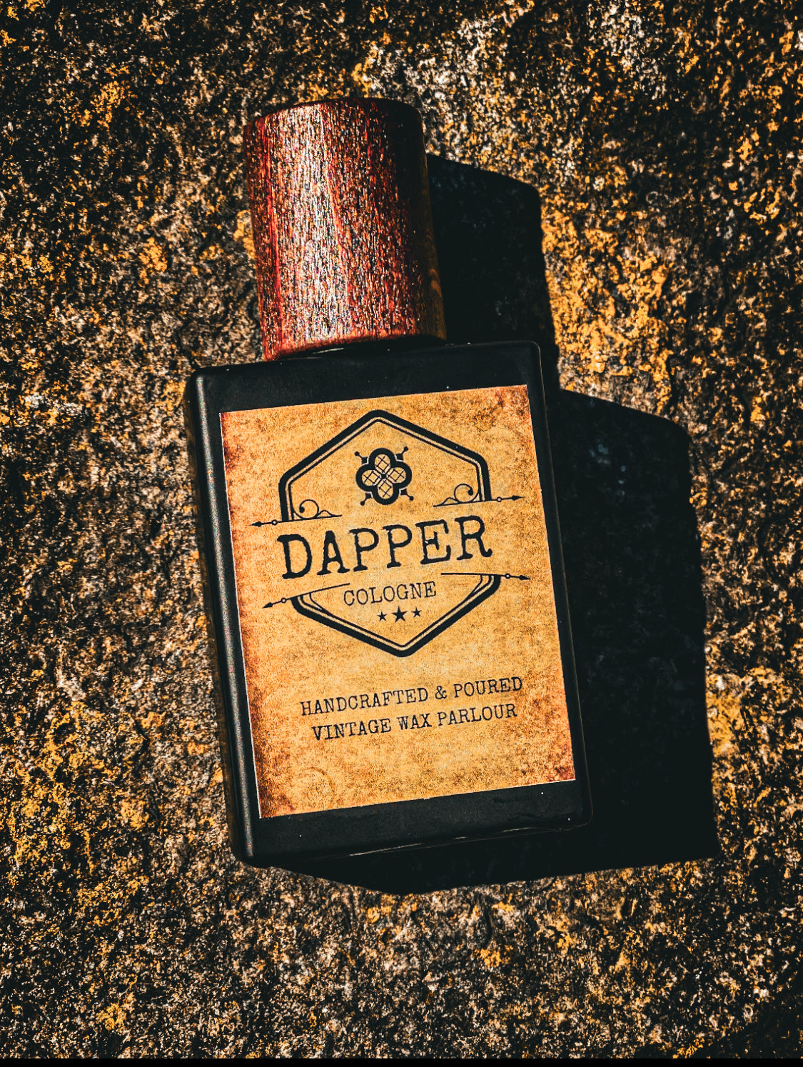 Dapper cologne bottle with wooden cap on a textured surface
