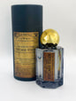 Perfume bottle with gold cap and 'Vintage Vixen' label on a white background