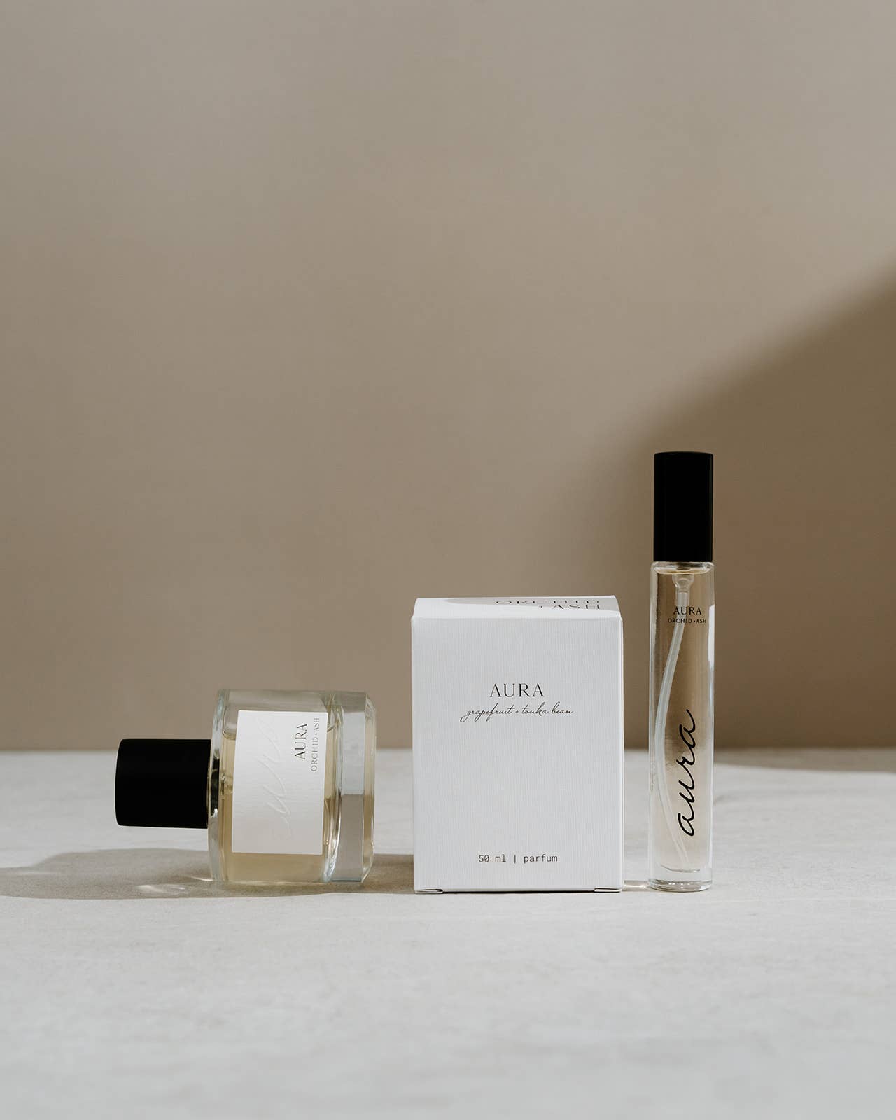 Orchid + Ash Aura 1.7 oz EDP Spray bottles